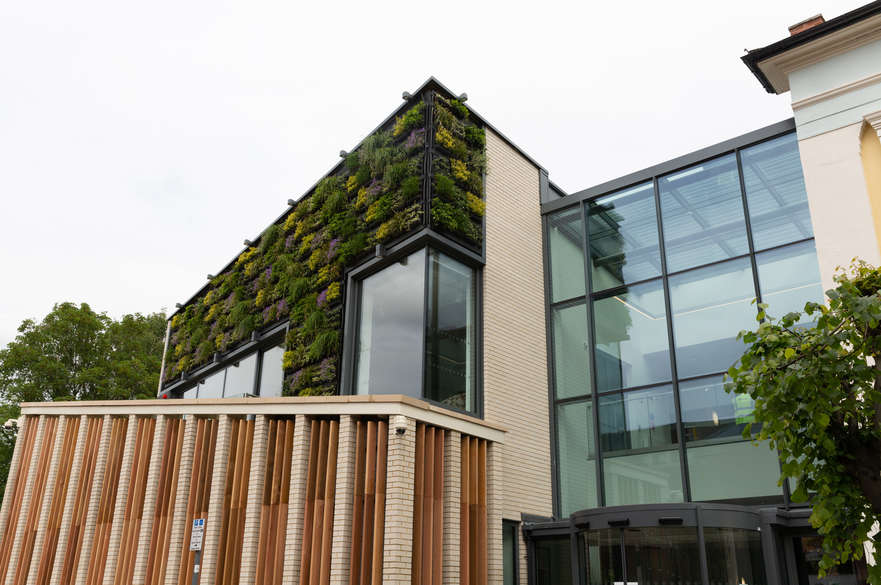 External image of University Hall with green living wall