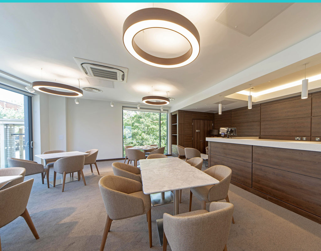 Stunning new dining hall with marble tables, rounded furniture and natural lighting