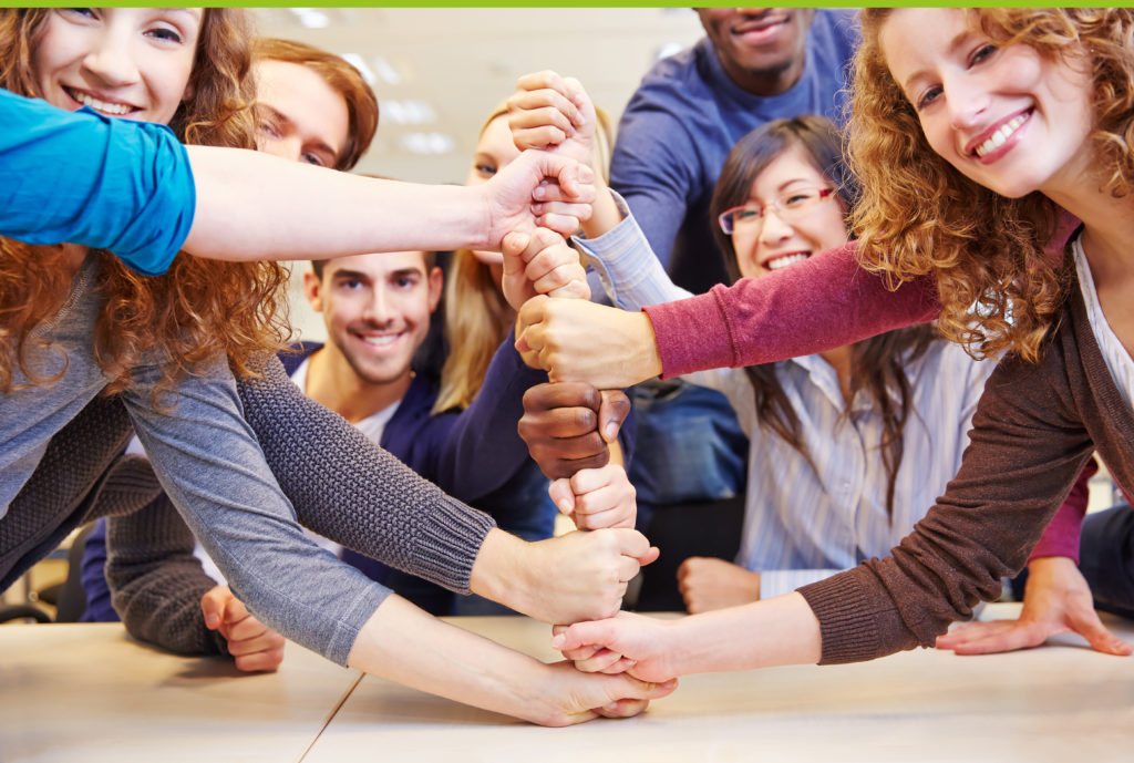 Group of men and women taking part in team building