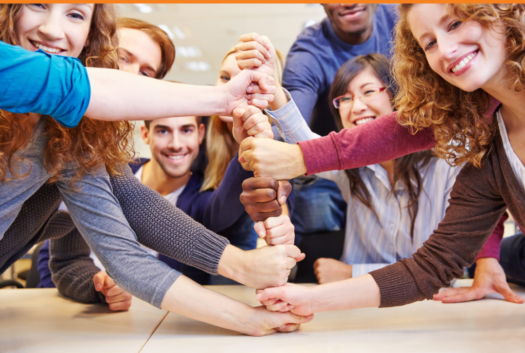 Group of men and women taking part in team building